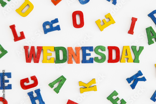 Series  Weekday   word Wednesday in wooden letters on white background  