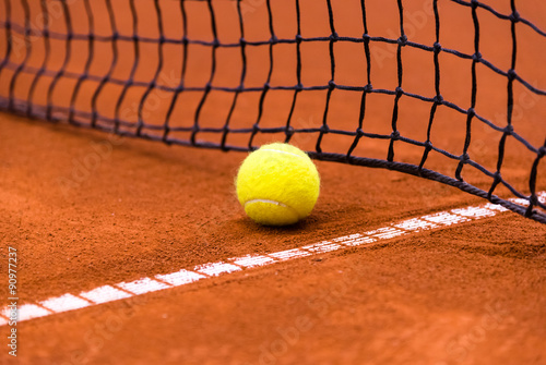 tennis ball on a clay court
