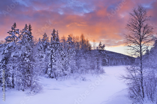 Sunrise over a river in winter near Levi, Finnish Lapland © sara_winter