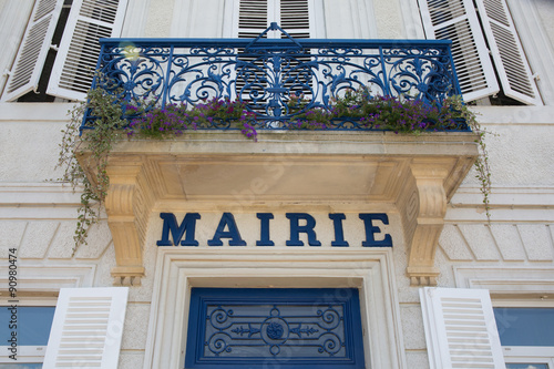Very nice and modern city hall written in a blue letters mairie in french photo