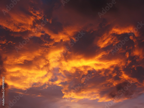 Dramatic sunset like fire in the sky with golden clouds