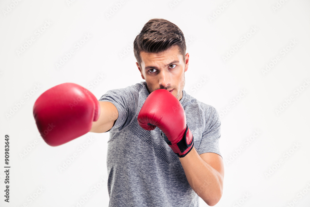 Man hitting at camera in boxing gloves Man hitting at camera in boxing gloves