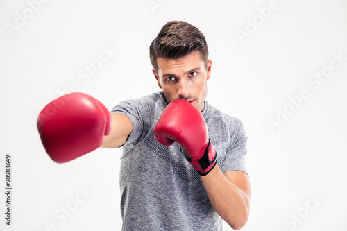Man hitting at camera in boxing gloves © Drobot Dean