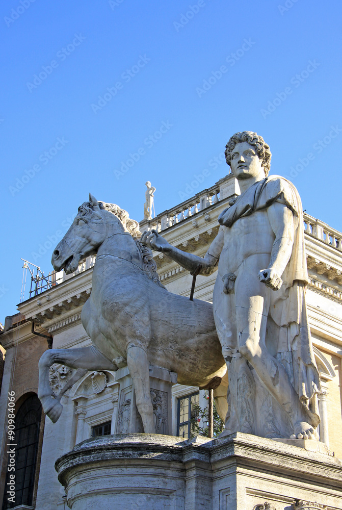 Obraz premium Statue of Castor at the Cordonata stairs on Capitoline Hill, Rome Italy