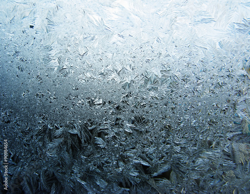 Obraz na płótnie snowflakes ice on glass abstract texture background w salonie