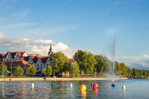 Fototapeta Naklejka Na Ścianę i Meble -  Elk panorama with lake and fountain. Masuria, Poland.