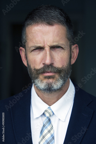 portrait of handsome businessman looking angry