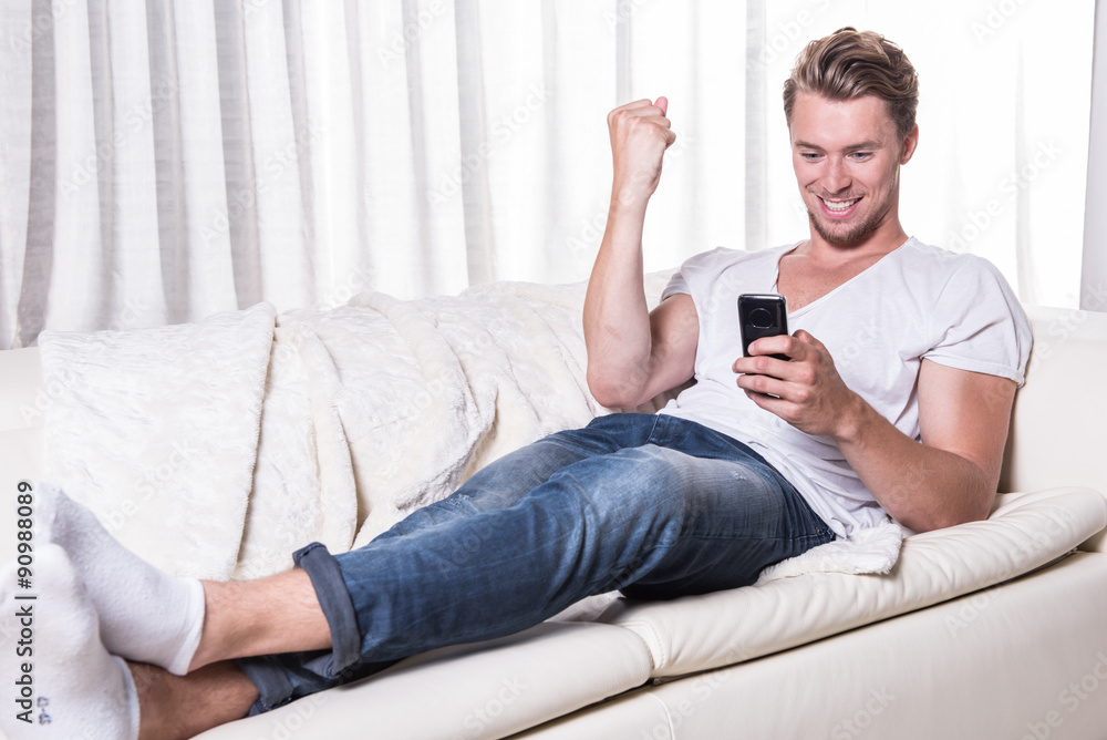 young man likes message on smartphone