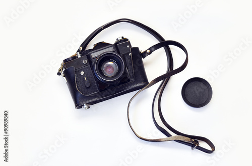 Old photo camera. Old photo camera on a white background. Camera in leather carrying case with strap, lens. Zenit.