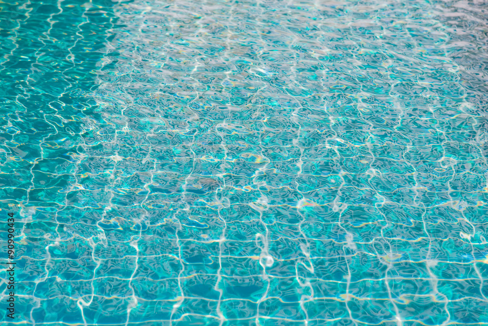 Obraz premium blue swimming pool with sunny reflections