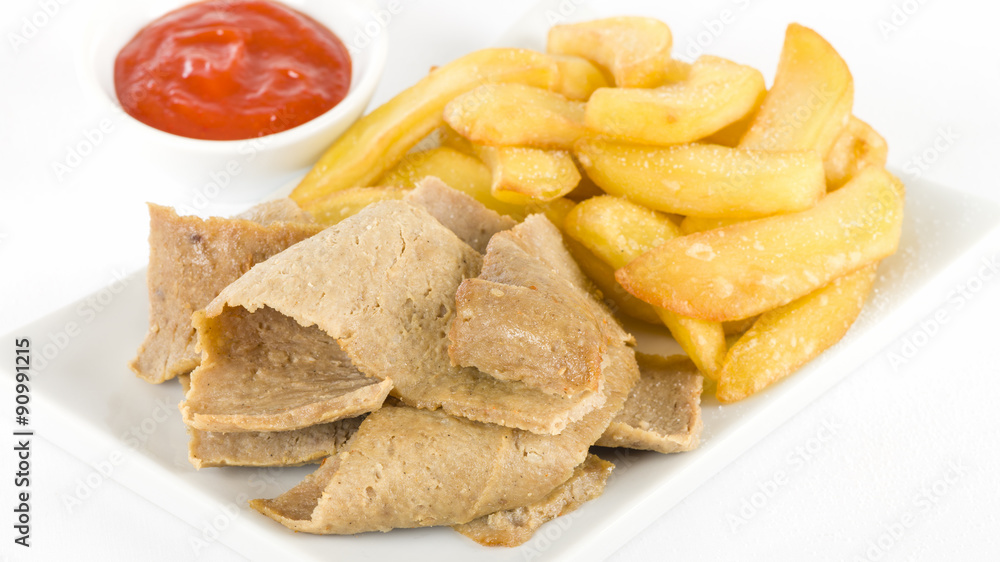 Donner Meat & Chips - Spicy lamb kebab slices served with fries and chilli sauce on a white background.
Donner Meat & Chips - Spicy lamb kebab slices served with fries and chilli sauce on a white background.
