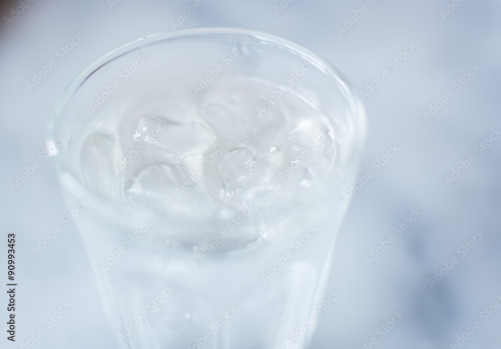 Soft focus. Glass of pure fresh water with ice , focus on ice Soft focus. Glass of pure fresh water with ice , focus on ice