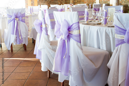 wedding chairs with ribbon, event place