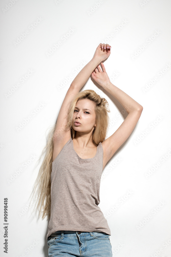 Young European attractive sexy fashion model with long blond natural hair, beautiful eyes, full lips, perfect skin is posing in studio for glamourous test photo shoot Young European attractive sexy fashion model with long blond natural hair, beautiful eyes, full lips, perfect skin is posing in studio for glamourous test photo shoot