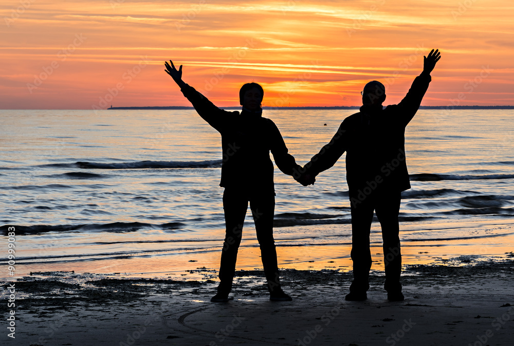 Fototapeta premium Couple of happy seniors at sandy beach of the Baltic Sea