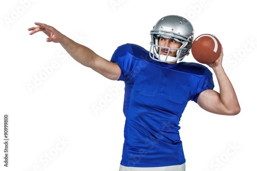 American football player about to throw the ball