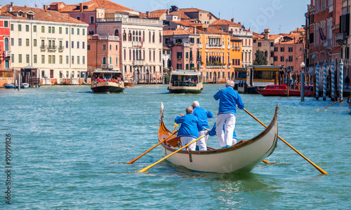 Gondolier gondola on Grand canal Venice Italy