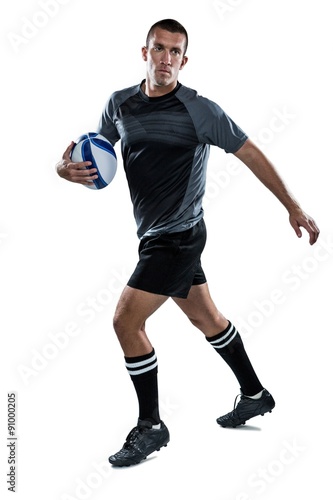 Sportsman running with ball © WavebreakMediaMicro