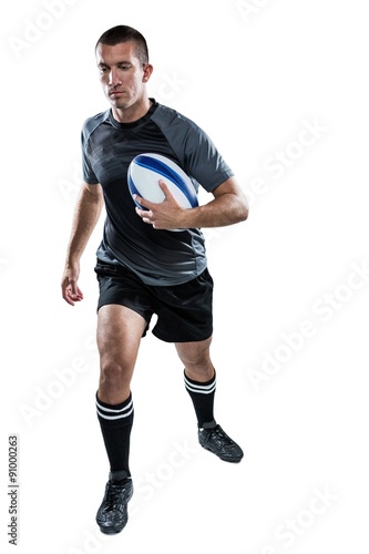 Sports player running with ball © WavebreakmediaMicro