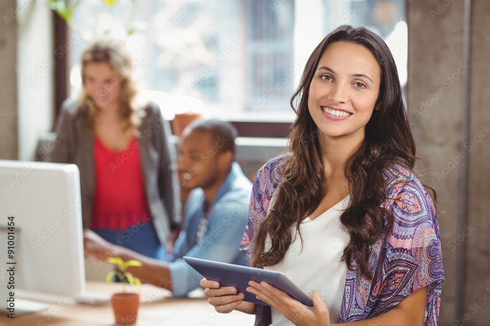 Portrait of smiling businesswoman holding digital tablet Portrait of smiling businesswoman holding digital tablet