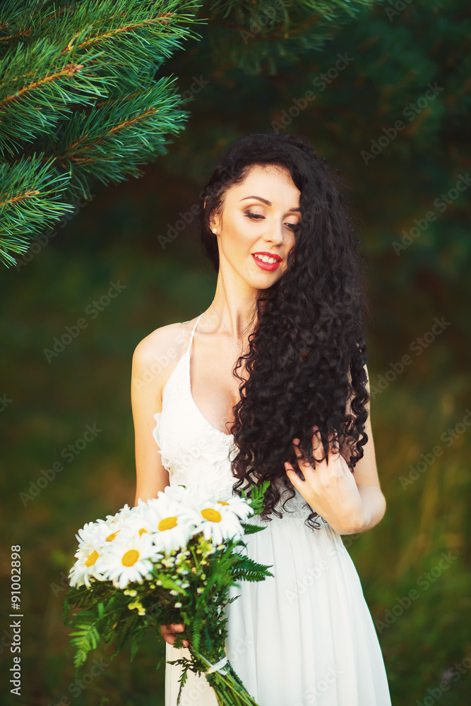 beautiful girl in the field, with long black hair beautiful girl in the field, with long black hair