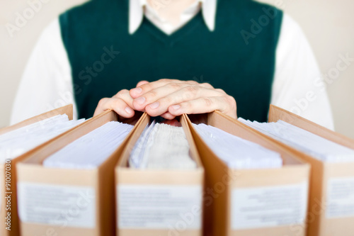 Businessman with binders at office.