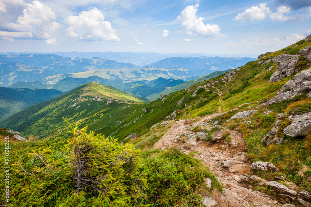 Landscape with Carpathian mountains track and sky clouds