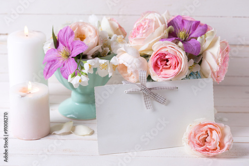 Roses, jasmine,  clematis  flowers and empty tag