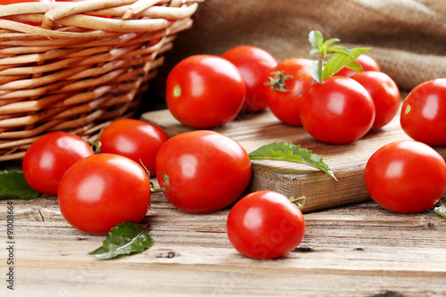 Fresh red tomatoes on wooden table