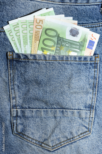 Euro banknotes in jeans back pocket
