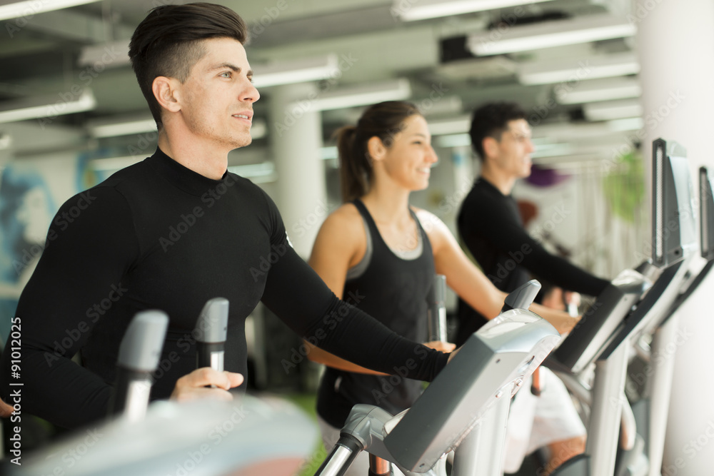 Fototapeta premium Young people training in the gym