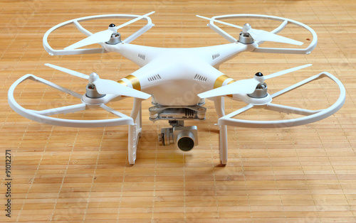 Drone quadrocopter with high resolution digital camera. New tool for aerial photo and video. 