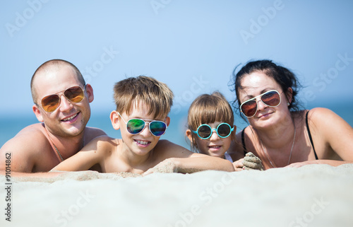 family resting on the sea