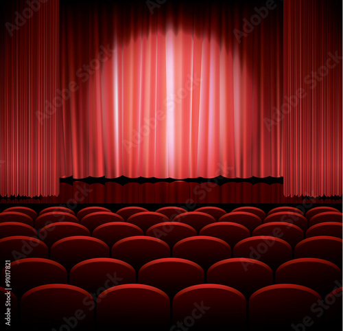 Theater stage with red curtain and spot light