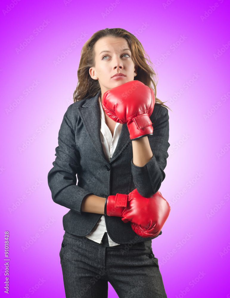 Young businesswoman in boxing concept Young businesswoman in boxing concept