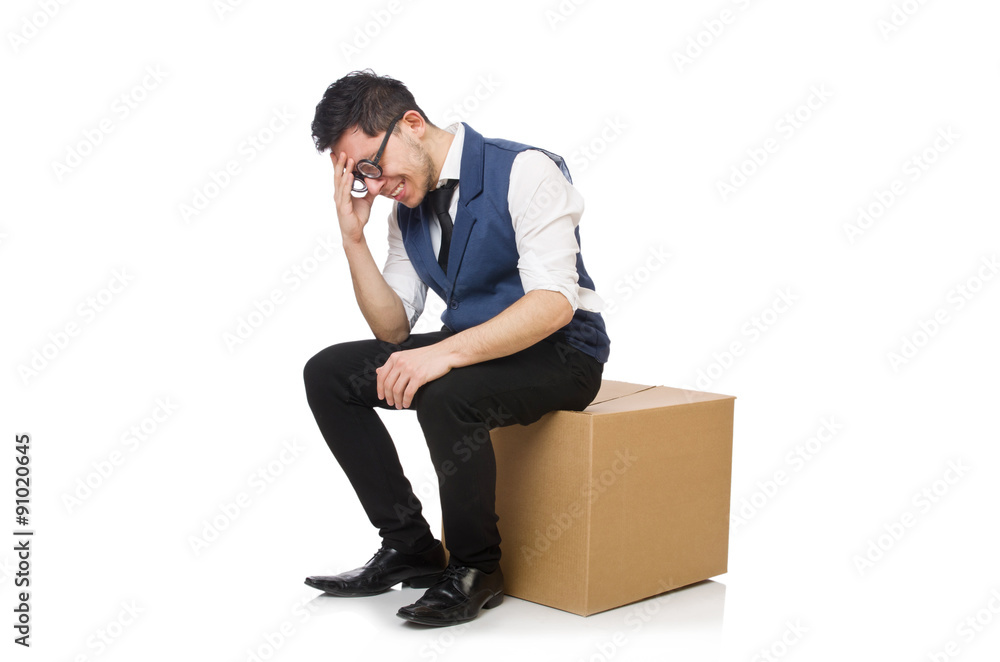 Young employee sitting on the box isolated on white