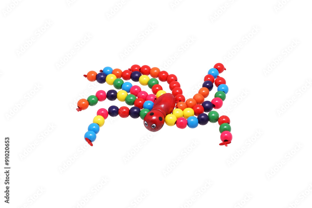 Toy spider of bright beads.