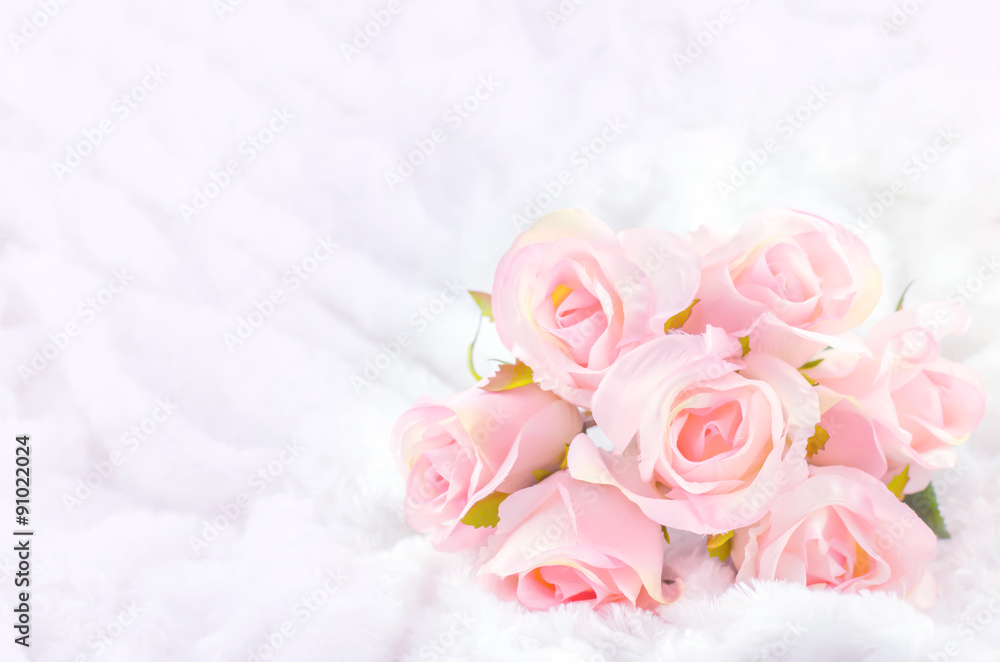 Pastel Coloured Artificial Pink Rose on white fur background