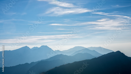 Mountain ridges in summer mist