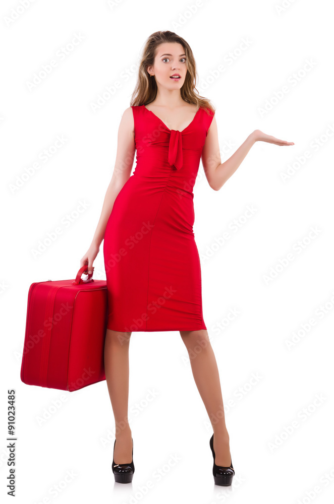 Young woman in red dress with suitcase isolated on white Young woman in red dress with suitcase isolated on white
