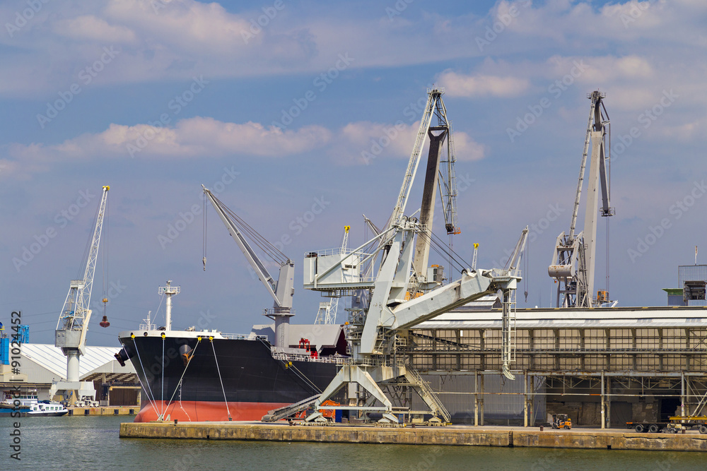 Oil tanker moored near an oil silo in Port of Antwerp