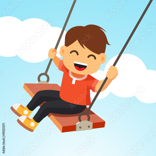 Happy smiling boy kid swinging on a swing