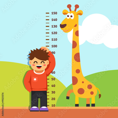 Boy kid measuring his height at kindergarten wall