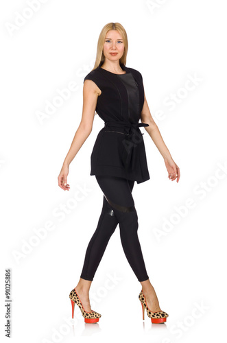 Pretty woman in tight black pants isolated on white © Elnur