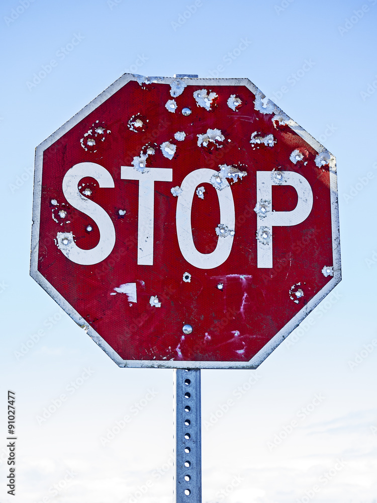 Obraz premium Stop Sign With Bullet Holes