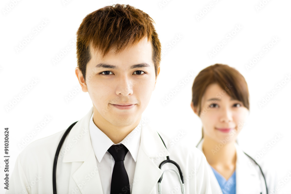 smiling male and female doctors standing together smiling male and female doctors standing together