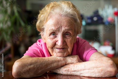 Closeup portrait of happy elderly woman. photo