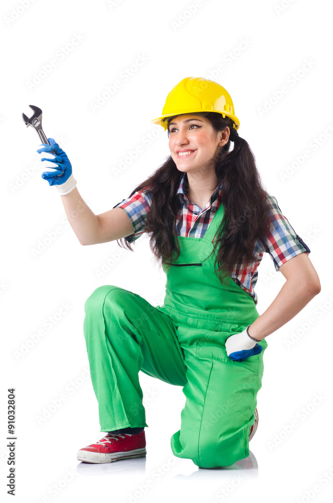 Female workman in green overalls holding key isolated on white