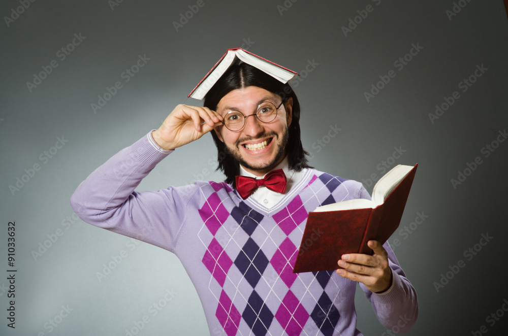 Young student with book in learning concept Young student with book in learning concept