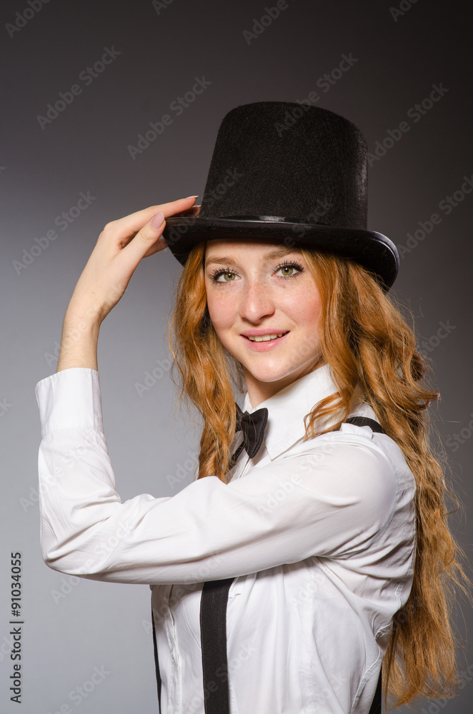 Red hair girl in classic style against gray Red hair girl in classic style against gray
